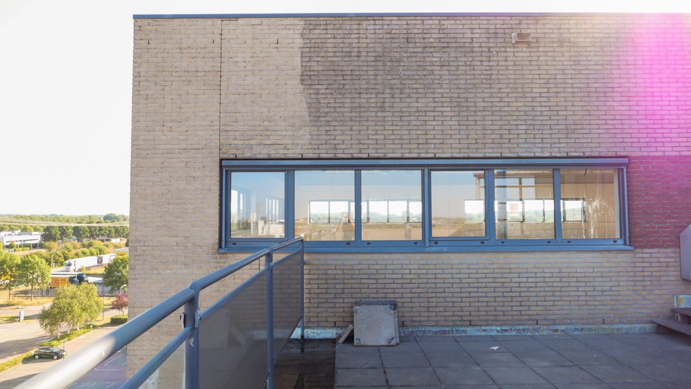 Facade at Pulse showing the contrast between cleaned and uncleaned brick