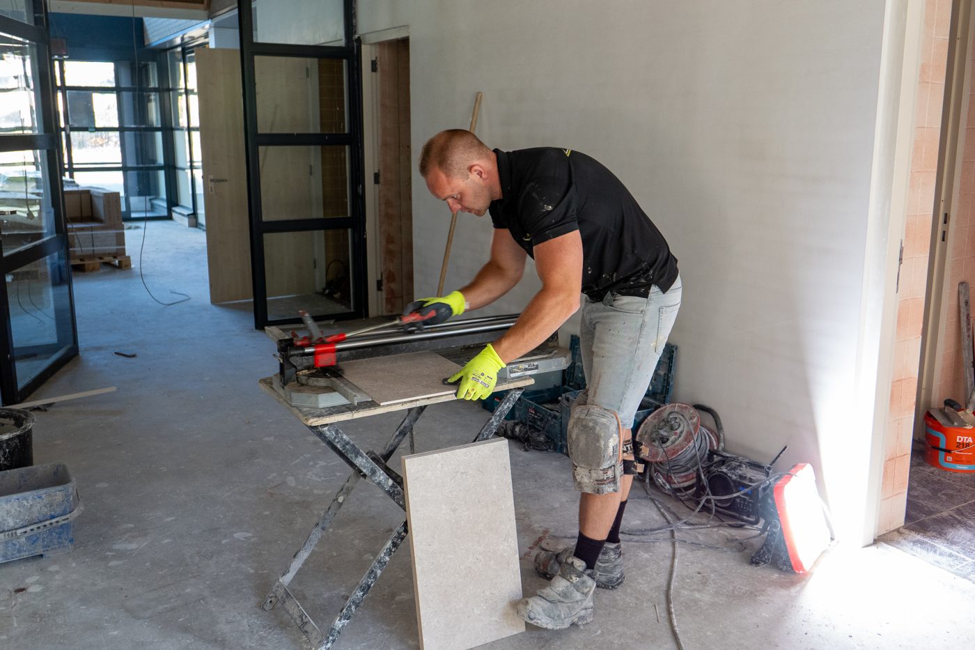 Cutting tile on site at Pulse