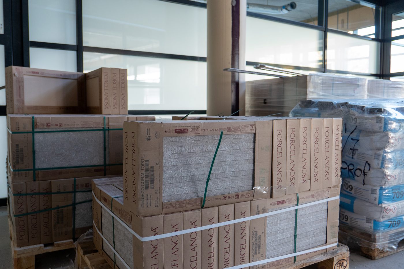 Pallets of tile material delivered on site at Pulse