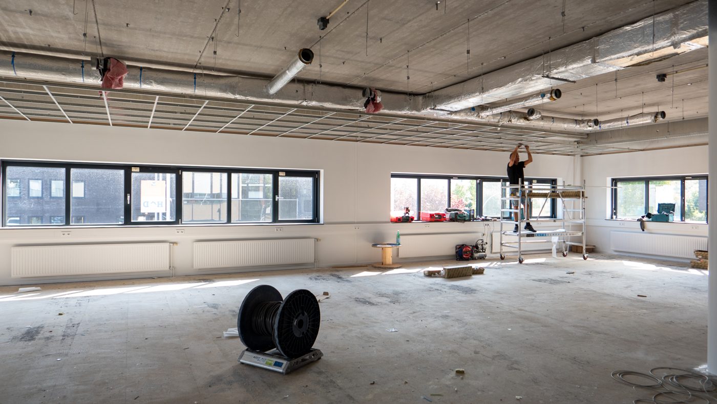 Working on the ceiling from a scaffold tower at Pulse